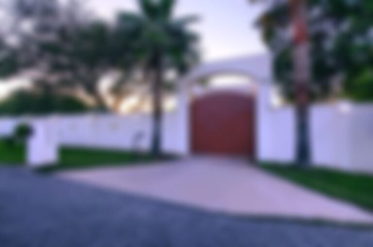 10,000 pound front entry gate, surrounded by abundant security lighting (approx 80).