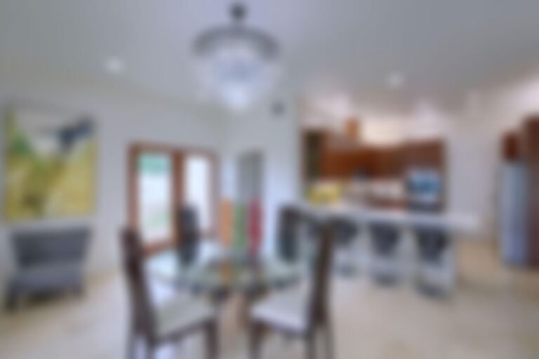 Breakfast dining area overlooks the pool and back veranda.