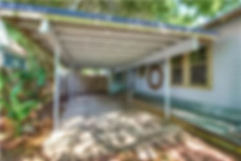 Carport leads to kitchen aand front porch
