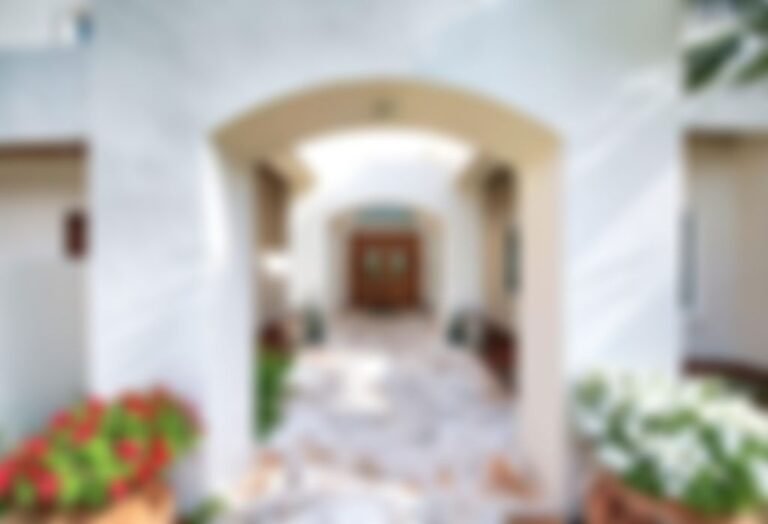 Grand entrance leads to beautifully crafted double doors.