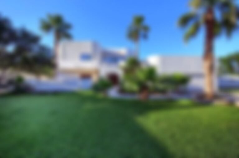 Lush grounds containing dozens of 60-foot tall palm trees.