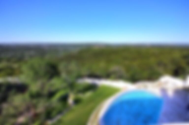Lushly landscaped property adjoins 30000-acre protected bird sanctuary.