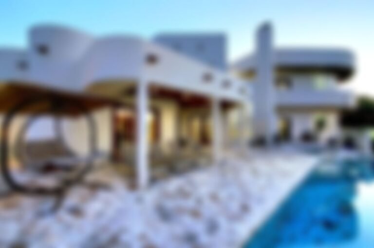 Plenty of relaxation space under the partially covered patio complete with an outdoor fireplace, pool and hot tub.